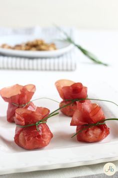 small pieces of food on a white plate