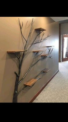 an empty hallway with metal branches on the wall