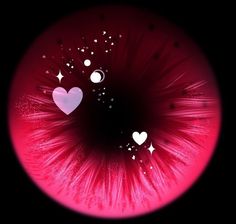 the inside of an eye with hearts and stars on it's irise lens