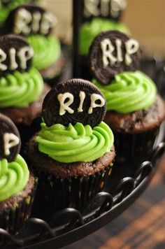 cupcakes with green frosting and oreo cookies on top that say rip