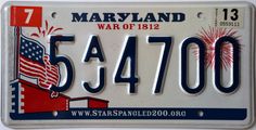 a license plate with an american flag and fireworks