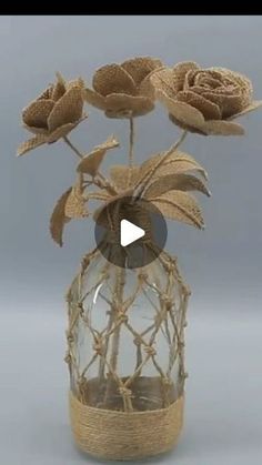 a glass vase filled with flowers on top of a table