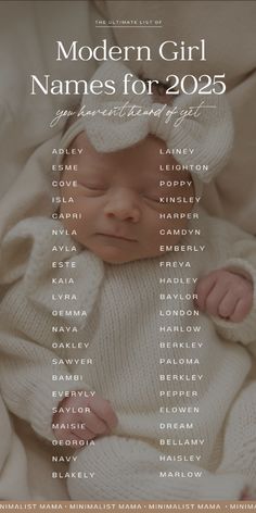 a baby wrapped in a white blanket with the names of its newborns on it