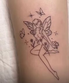 a small tattoo with a fairy on it