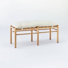 a wooden bench with a cushion on it