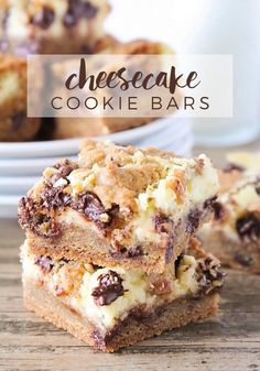 chocolate chip cheesecake cookie bars stacked on top of each other in front of plates