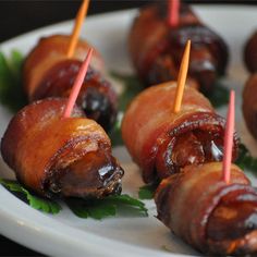 bacon wrapped pretzels on a plate with toothpicks