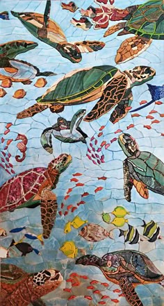 a mosaic depicting sea turtles swimming in the ocean