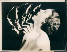 a black and white photo of three women with their heads in the shape of faces