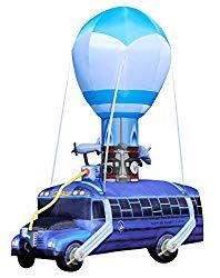 an image of a hot air balloon with a man standing next to it on top of a car