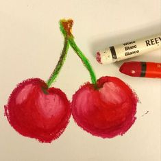 two cherries are drawn with crayons on paper and next to it is a marker