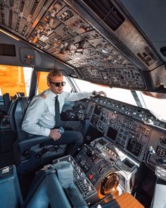 a man sitting in the cockpit of an airplane