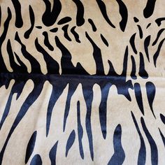 an animal print fabric with black and white stripes