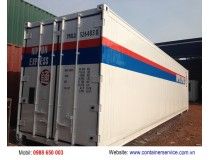 an image of the back side of a shipping container that is painted white, blue and red