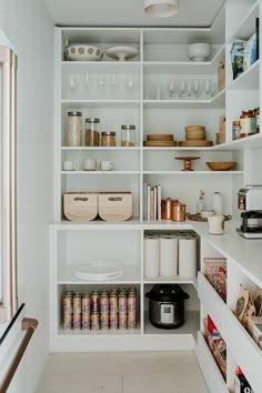 an organized pantry with lots of items on the shelves