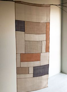 a large piece of cloth hanging on a wall