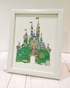 a white frame with a drawing of a castle on it