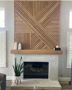 a living room with a fire place and wooden paneling on the wall above it