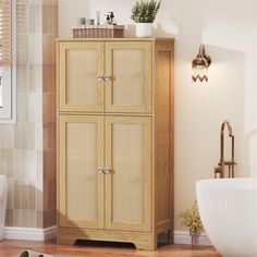 a bathroom with a wooden cabinet next to a toilet