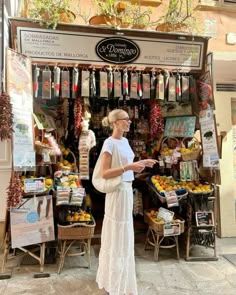 a woman standing in front of a store