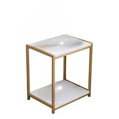 a white and gold side table with two shelves