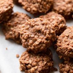 some cookies are sitting on a white plate and ready to be eaten by someone else