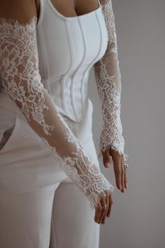 Elevate your bridal style with these stunning 20-inch long wedding sleeves, crafted from delicate Chantilly lace. Designed to complement any wedding dress, these fingerless, detachable sleeves feature a beautiful scalloped lace edge on both ends, adding timeless elegance and intricate detail. The scalloped edges provide a romantic, vintage-inspired touch, framing your arms in lace from wrist to elbow. These lace bridal sleeves offer a perfect balance of sophistication and practicality with their Detachable Lace Sleeves, Wedding Lace Gloves, Bridal Sleeves Detachable, Wedding Sleeves Detachable, Lace Gloves Wedding, Wedding Sleeves, Bridal Sleeves, White Lace Gloves, Capelet Dress