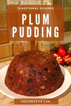 a close up of a cake on a plate with the words plum pudding above it