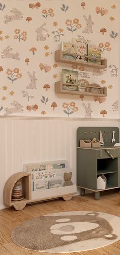 a child's room with wallpaper and rugs in the shape of animals