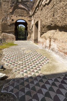 an old building with mosaic tiles on the floor