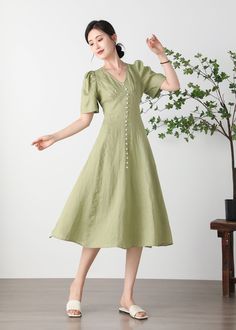 Cool and comfortable for hot summer days, this natural linen dress is elegant and stylish.    It is a wonderful wardrobe staple that's a timeless classic you'll wear again and again.Pure natural linen materials, comfortable, breathable, refreshing and soft fabric. All our items are Tailored and Handmade and Made to Order ,I can make Any Size . I design new styles every week, please collect my store. I believe that you will meet your favorite styles. ★★FEATURES Linen 55% + Cotton 45% ( Medium Wei Short Sleeve Linen Dress, Elegant Summer A-line Linen Dress, Spring Linen A-line Midi Dress, Linen A-line Midi Dress For Vacation, Spring A-line V-neck Dress, Beige A-line Linen Dress For Spring, Spring Beige A-line Linen Dress, Summer Linen V-neck Sundress, Elegant A-line Linen Beach Dress