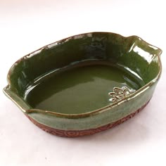 A stunning handmade pottery baking and serving dish.  This natural beauty goes from oven to table with style and ease. Made from durable stoneware clay, it retains heat remarkably well. Glazed in a rich evergreen shade, with natural textured base. Approximately 11.5" x 8" x 2.5. It would be a great size for a casserole or family size, side dish. Pottery Oven Dish, Hand Built Pottery Casserole Dish, Handmade Casserole Dish, Casserole Dish Pottery, Pottery Casserole Dishes, Ceramic Casserole Dish, Ceramic Casserole, Pottery Projects, Ceramic Baking Dish