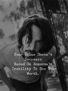 an image of a man with his head down and the caption below it reads, your value doesn't increase based on someone's inability to see your worth