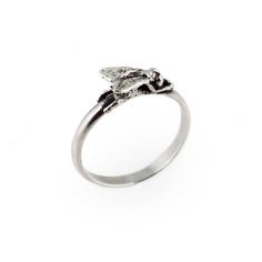 a silver ring with a bird on it