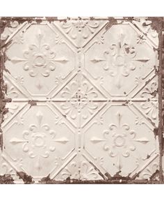 an old tin ceiling tile with white paint