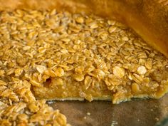 a close up of a pie with oats on it