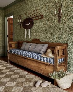 a wooden bench sitting in the middle of a living room