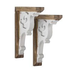 two wooden brackets with white paint and wood trim on each end, one is holding the other