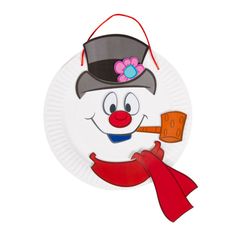 a paper plate with a snowman holding a red scarf and hat on it's head