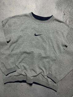 Vintage Crewneck Nike boxy center swoosh y2k fits logo USA 🇺🇸 Size Men's / US XL / EU 56 / 4 Color Grey Condition Gently Used Nike Vintage central logo central swoosh crewneck 80s 90s 00s retro spellout y2k sweatshirt centre swoosh big logo. The material is pleasant to the body. In a good condition. Fast sending! Condition : 8,8/10 Chest - 65 cm Length - 66 cm Shoulders - 59 cm Sleeve Length - 63 cm - ALL ITEMS ARE HEAT TREATED AND WASHED BEFORE SHIPPING - FOLLOW MY STORE - SEE MY OTHER ITEMS Mens Vintage Nike Sweatshirt, Sweat Shirts Mens, Vintage Crewneck Outfit, Vintage Nike Outfits, Nike Outfits Men, Logo Usa, Au Logo, Crewneck Outfit, Central Logo