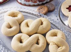 doughnuts and other pastries on a glass platter