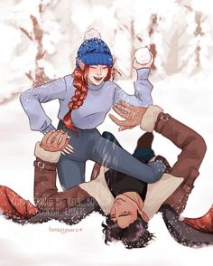 two people are playing in the snow with one holding onto another person's leg