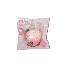 a pink toy in a package on a white background