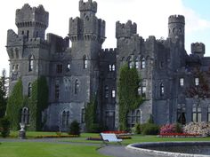 an old castle with ivy growing on it's walls