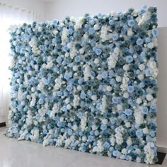 a large blue and white flowered wall in an empty room with no one around it