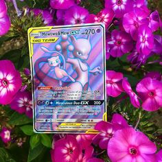 a close up of a pokemon card surrounded by flowers