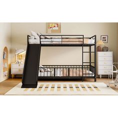 a bunk bed with a slide on top of it in a child's room