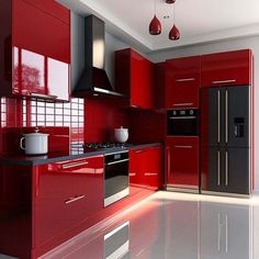 a modern kitchen with red cabinets and stainless steel appliances, including a coffee pot on the counter