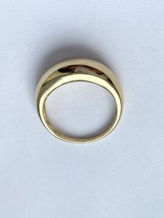 This Dome Ring has a complete smooth profile, simple and sleek enough to look well on a lady's hand. The finish is perfect polish.  This style is modern and trendy!  Details: Gold: 10K or 14K Yellow Gold  Width On Top of the Band: 7.5mm Width Bottom of the Band: 1.8mm Weight: 3.6g for size 7 approximately  Style: Dome Shape Ring Condition: New  *All Taxes Included for Canadian Customers.  Handmade in Montréal Canada 🇨🇦.  Please understand that the photos are ENLARGED to show detail for your benefit- please use the measurements provided in the item details/description to understand the size of the gem or Jewelry in the listing- measurements are given in millimeters unless otherwise noted. Please check the photos & sizes in the description carefully before placing an order to ensure you ar Bold Rings, Dome Ring, Trendy Ring, Domed Ring, Mom Birthday Gift, Everyday Jewelry, Gift For Mom, Ring Gift, Montreal