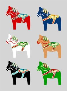 four different colored horses with designs on them